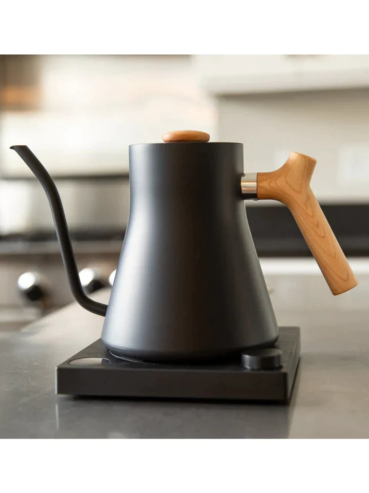 FELLOW Stagg EKG Electric Pour Over Kettle- Matte Black with Maple Handles on counter
