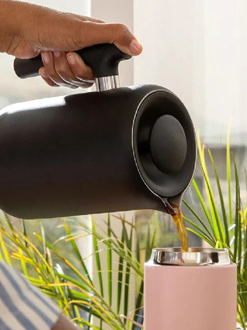 FELLOW Clara French Press pouring coffee in thermos