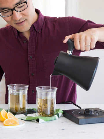 FELLOW Corvo EKG Electric Kettle man pouring tea